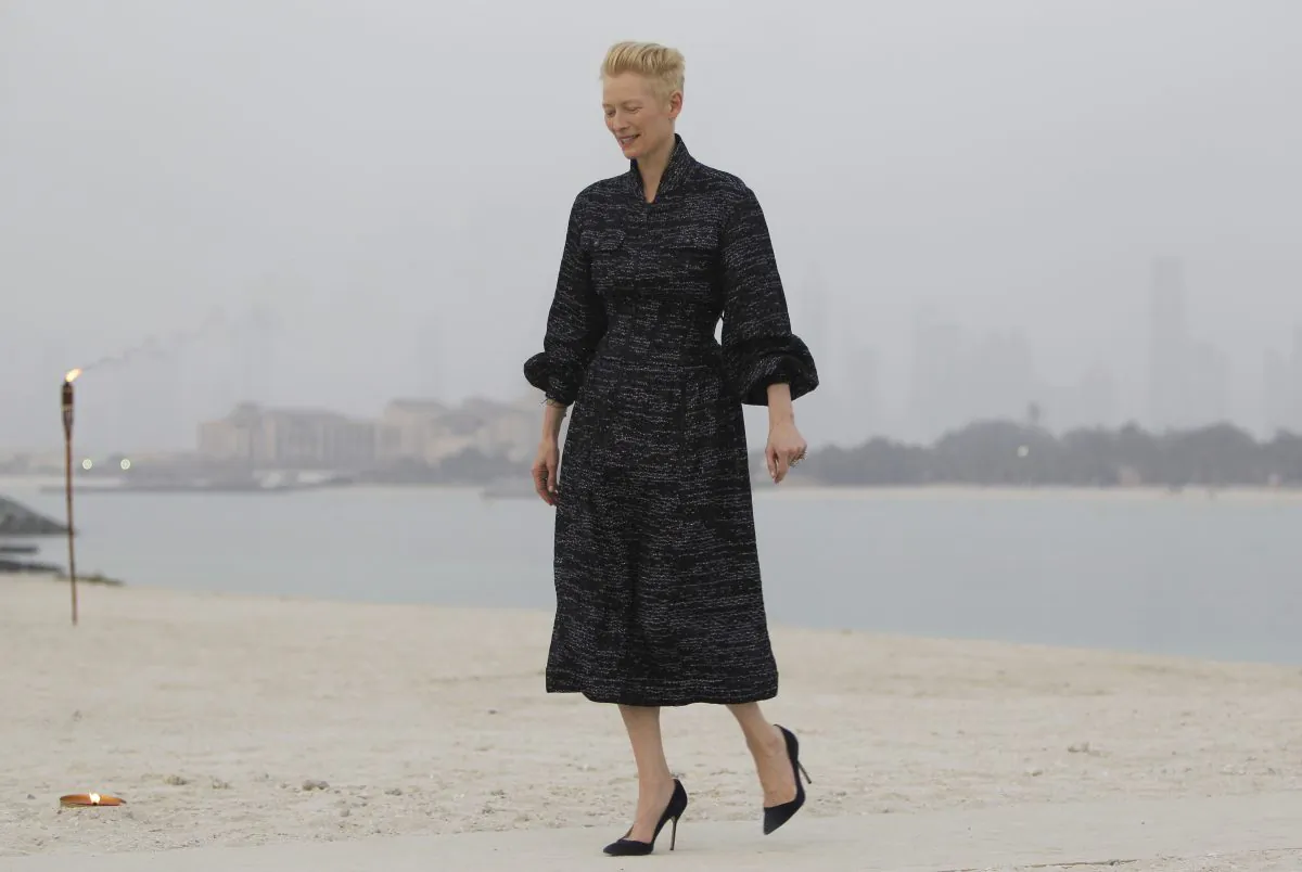 British actress Tilda Swinton arrives for the Chanel Cruise Dubai show revealing the French Maison's new Cruise collection of the 2014/15 season, staged on a private island in Dubai, United Arab Emirates, Tuesday, May 13, 2014. (AP Photo/Kamran Jebreili)