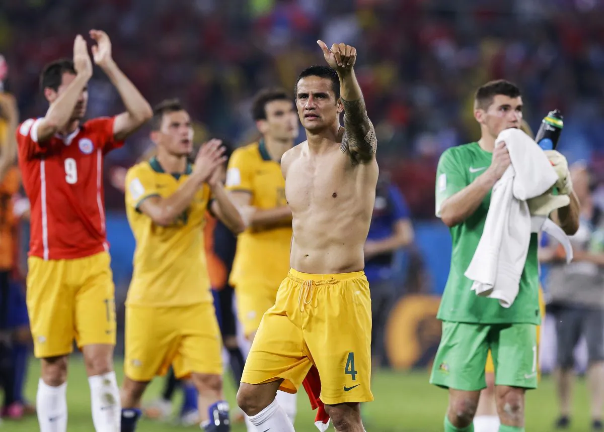 Australia's Tim Cahill (4) salutes spectators following their 3-1 loss to Chile during the group B World Cup soccer match between Chile and Australia in the Arena Pantanal in Cuiaba, Brazil, Friday, June 13, 2014. (AP Photo/Thanassis Stavrakis)
