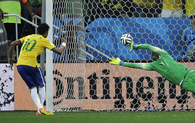 Brazil's Neymar, left, scores his sides second goal from the penalty spot during the group A World Cup soccer match between Brazil and Croatia, the opening game of the tournament, in the Itaquerao Stadium in Sao Paulo, Brazil, Thursday, June 12, 2014.  (AP Photo/Felipe Dana)