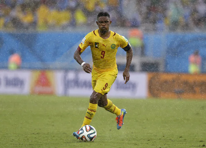 Cameroon's Samuel Eto’o runs with the ball during the group A World Cup soccer match between Mexico and Cameroon in the Arena das Dunas in Natal, Brazil, Friday, June 13, 2014. (AP Photo/Ricardo Mazalan)
