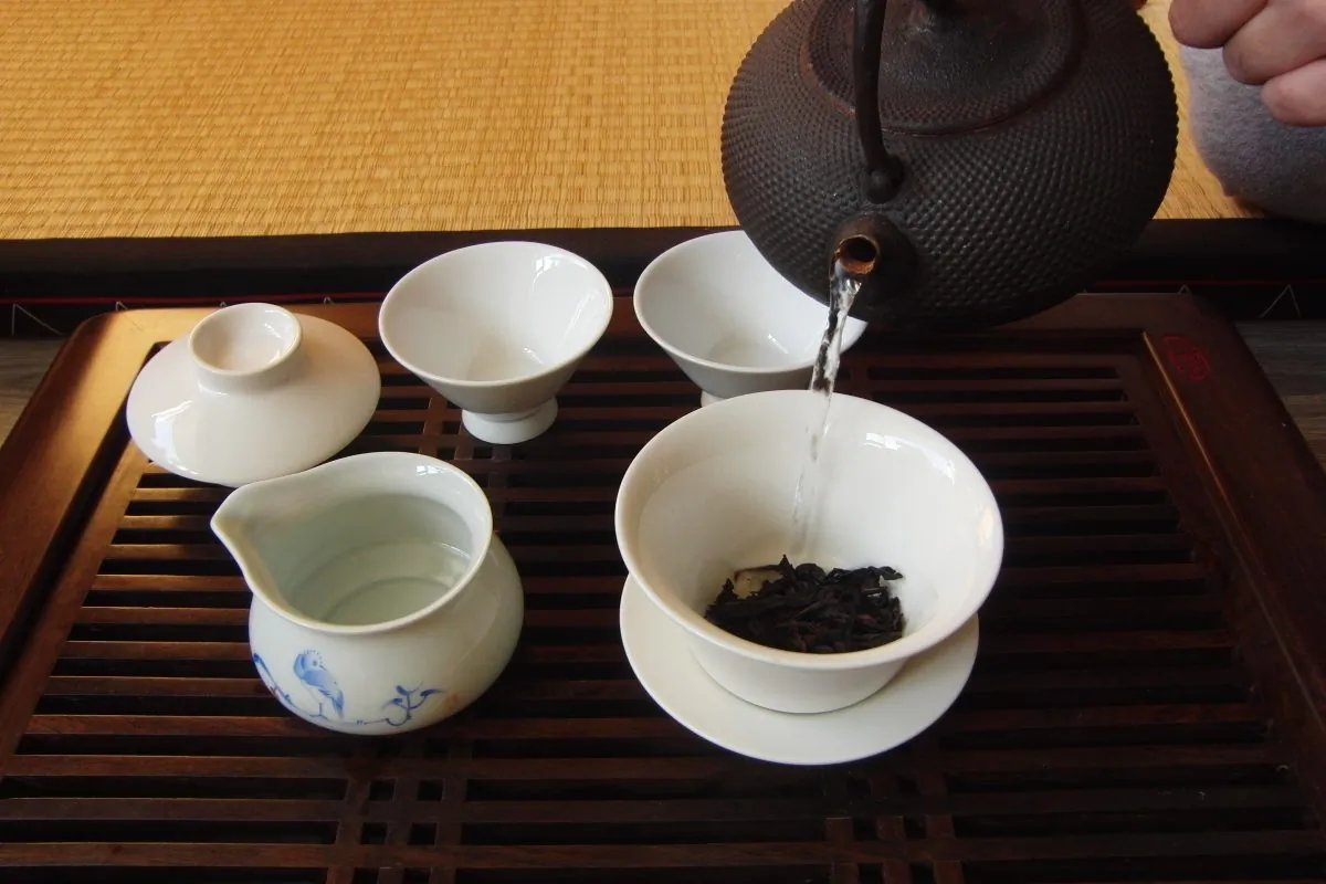Gently pour a small amount of hot water (around 90 to 100 degrees) onto the insides of the cup. (Peter Valk/Epoch Times)