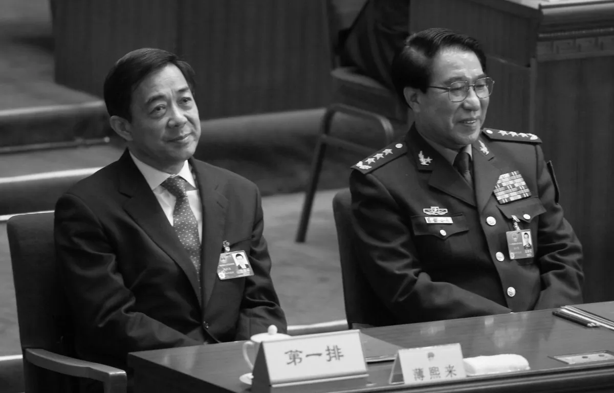Xu Caihou, right, former deputy chairman of the CPC Central Military Commission, which controls China’s military, and former Politburo member Bo Xilai attend the closing session of the National People's Congress at the Great Hall of the People in Beijing, China, March 14, 2012. (AP Photo/Vincent Thian, File)