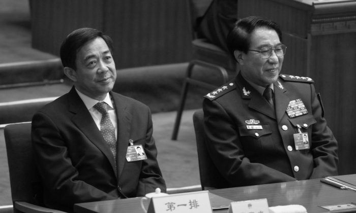Xu Caihou, right, former deputy chairman of the CPC Central Military Commission, which controls China’s military, and former Politburo member Bo Xilai attend the closing session of the National People's Congress at the Great Hall of the People in Beijing, China, March 14, 2012. (AP Photo/Vincent Thian, File)