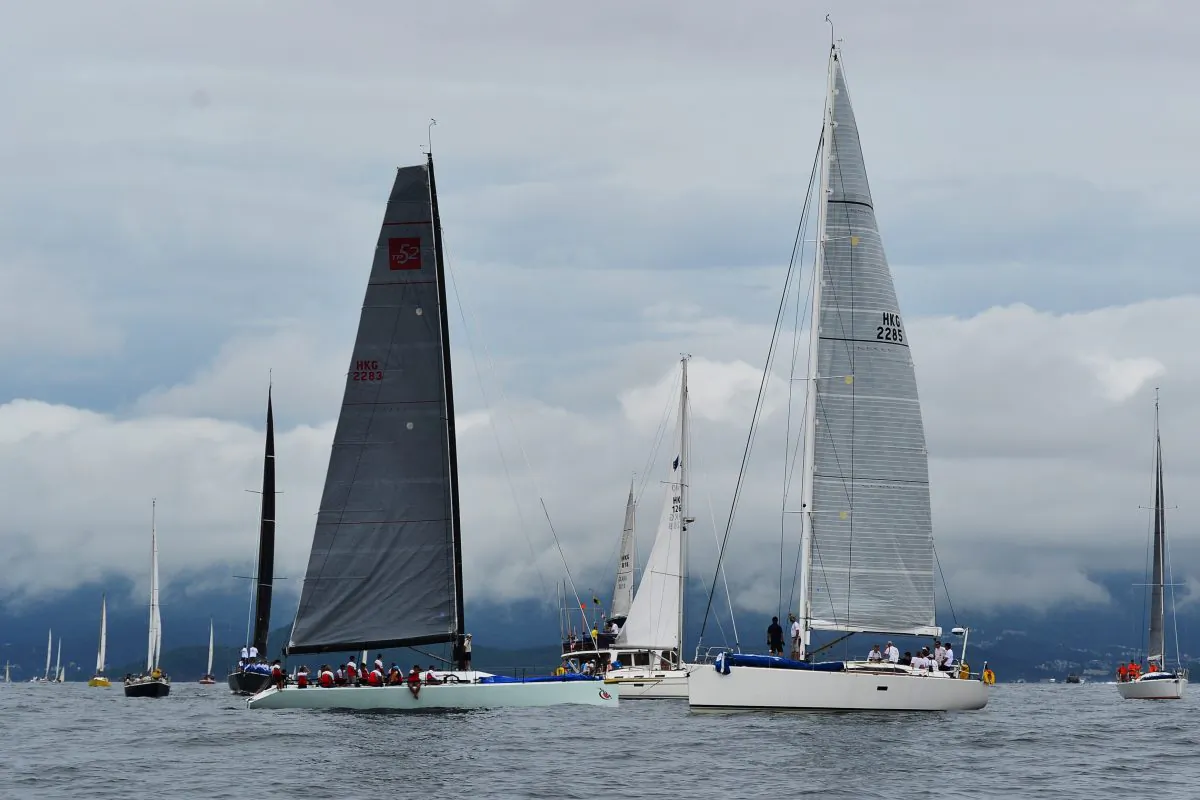 Boats cruising around the Committee Boat waiting for the start of Race-2 of the Hebe Haven Quest Yachting Typhoon Series on Sunday June 22, 2014. After waiting for more than 2-hours, lack of wind forced the proceedings to be abandoned. (Bill Cox/Epoch Times)