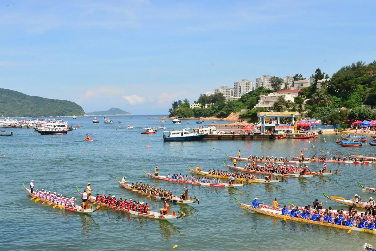 Competitors strive to win the many race categories at the Stanly International Dragon Boat Festival on Monday June 2, 2014. (Bill Cox/Epoch Times)