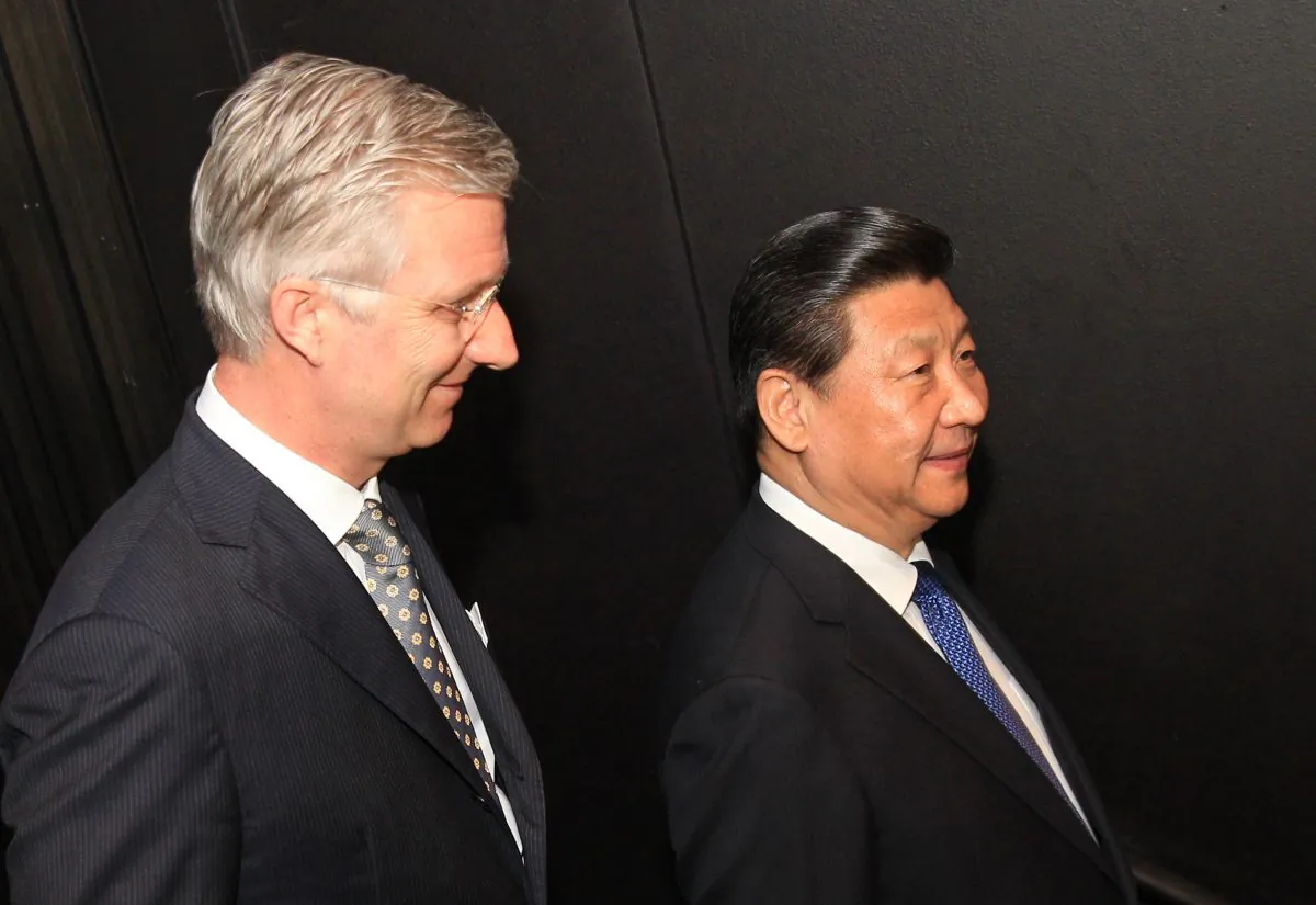 Belgium's King Philippe (L) and China's top leader Xi Jinping at the Concert building of Bruges on April 1, 2014, on the last leg of Xi's tour of Europe. (Yves Logghe/AFP/Getty Images)