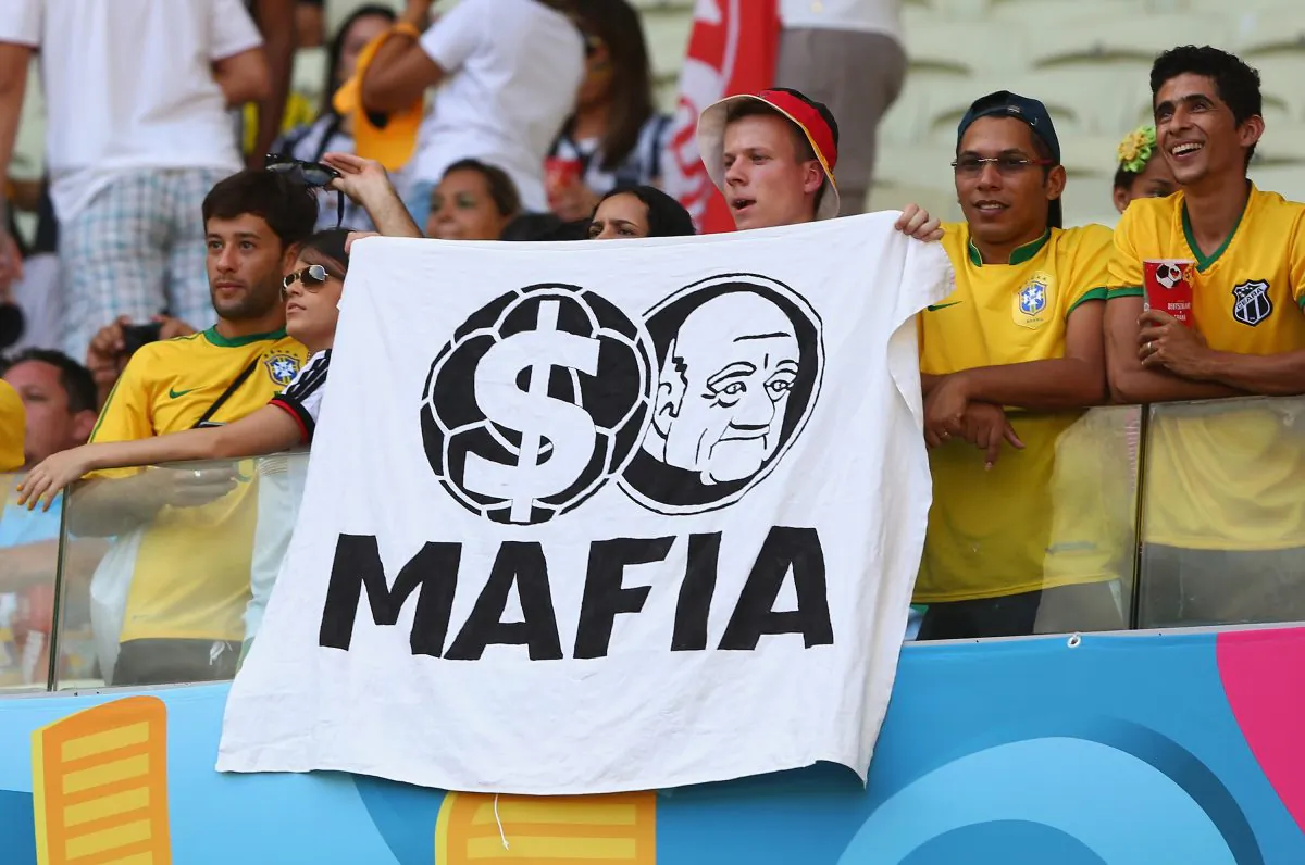 A fan holds up a protest banner during the 2014 FIFA World Cup Brazil match between Germany and Ghana in Fortaleza, Brazil, on June 21, 2014. (Martin Rose/Getty Images)