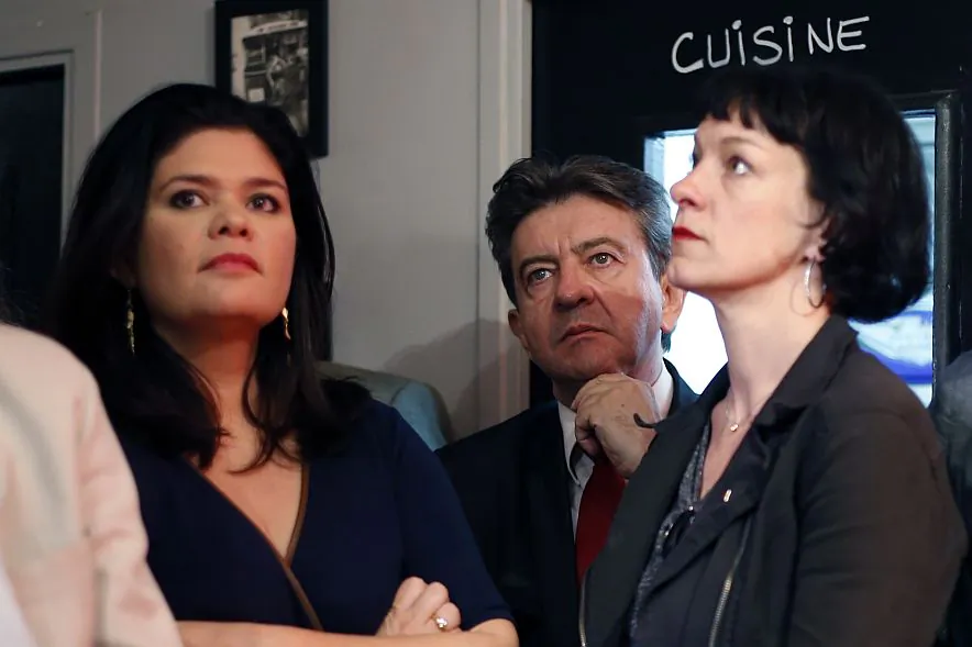 French left-wing party "Parti de Gauche" (PG) co-president Jean-Luc Melenchon (C) looks on next to PG candidates for the European elections Raquel Garrido (L) and Corinne Morel Darleux (R) after the announcement of the European Parliament elections results, on May 25, 2014. (Thomas Samson/AFP/Getty Images)