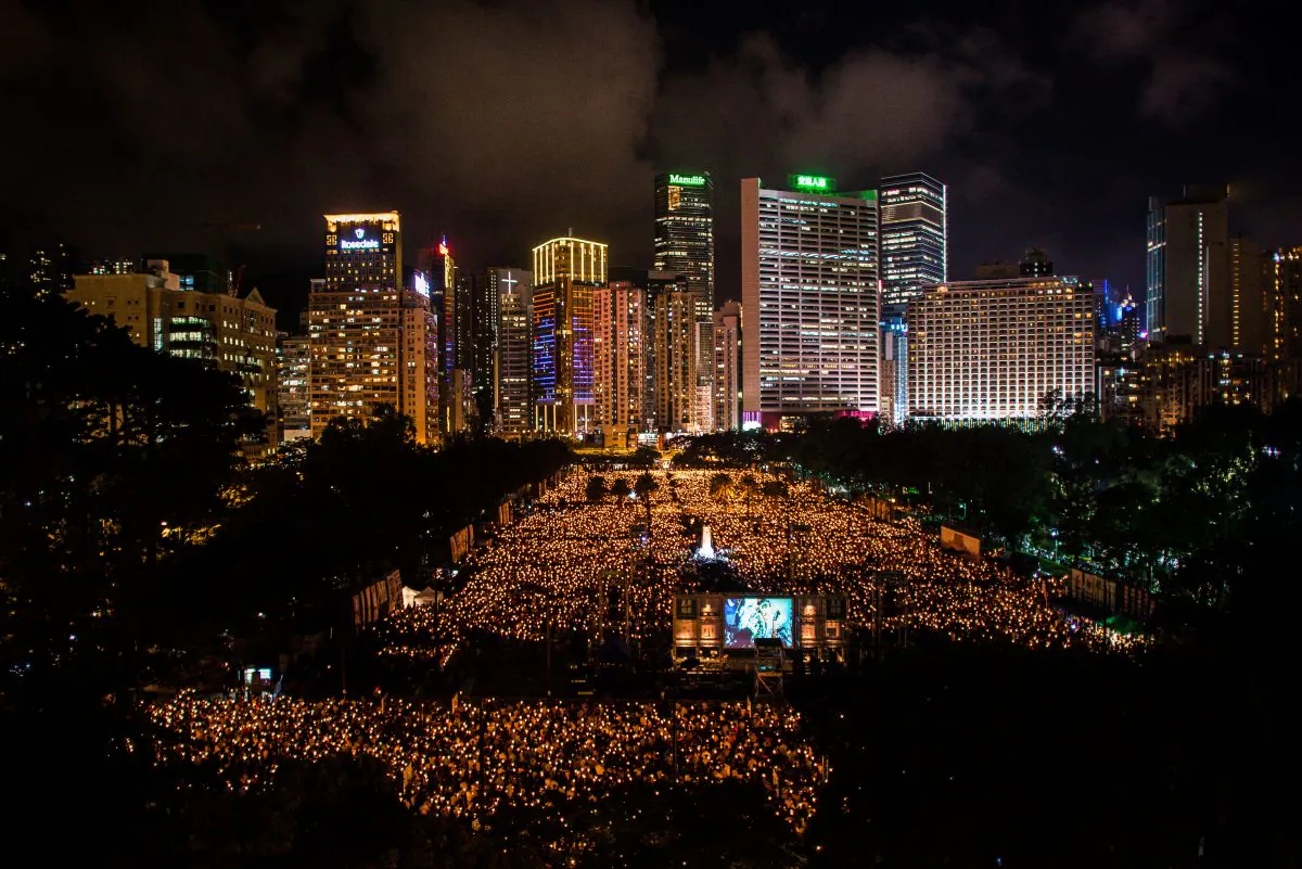 An estimated 180,000 people gather in Hong Kong's Victoria Park for a candlelight vigil memorializing the victims of the Tiananmen Square massacre and calling for the overthrow of the Chinese Communist Party on June 4, 2014. (Phillipe Lopez/AFP/Getty Images) 