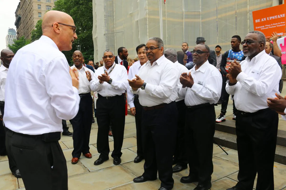 Brooklyn Community Chorus vocalists conclude Father's Day Pledge with "Great Gettin' Up Morning" rendition in Manhattan, on June 11, 2014. (Brendon Fallon/Epoch Times)