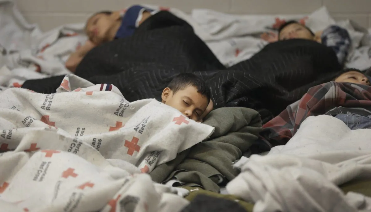 Detainees sleep in a holding cell at a U.S. Customs and Border Protection processing facility, on in Brownsville, Texas on June 18. (Eric Gay/Getty Images)