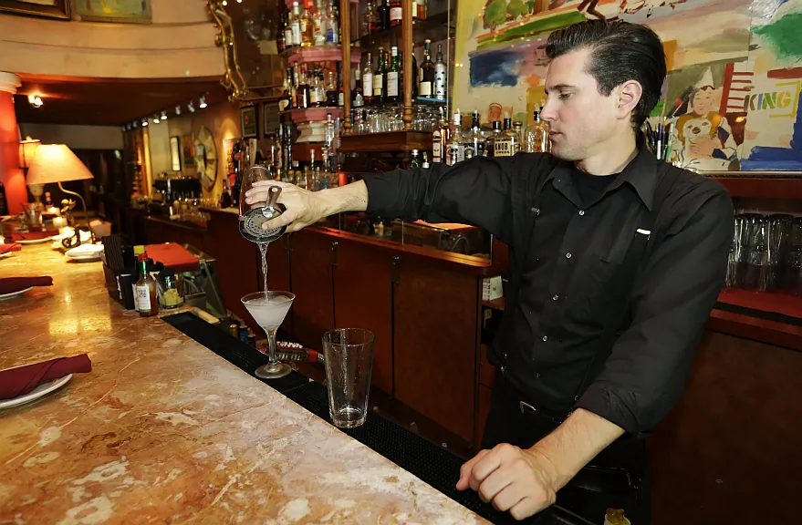 Gradie Wallen tends bar at the icon Grill in Seattle,  Wash., on June 2. (AP Photo/Ted S. Warren) 