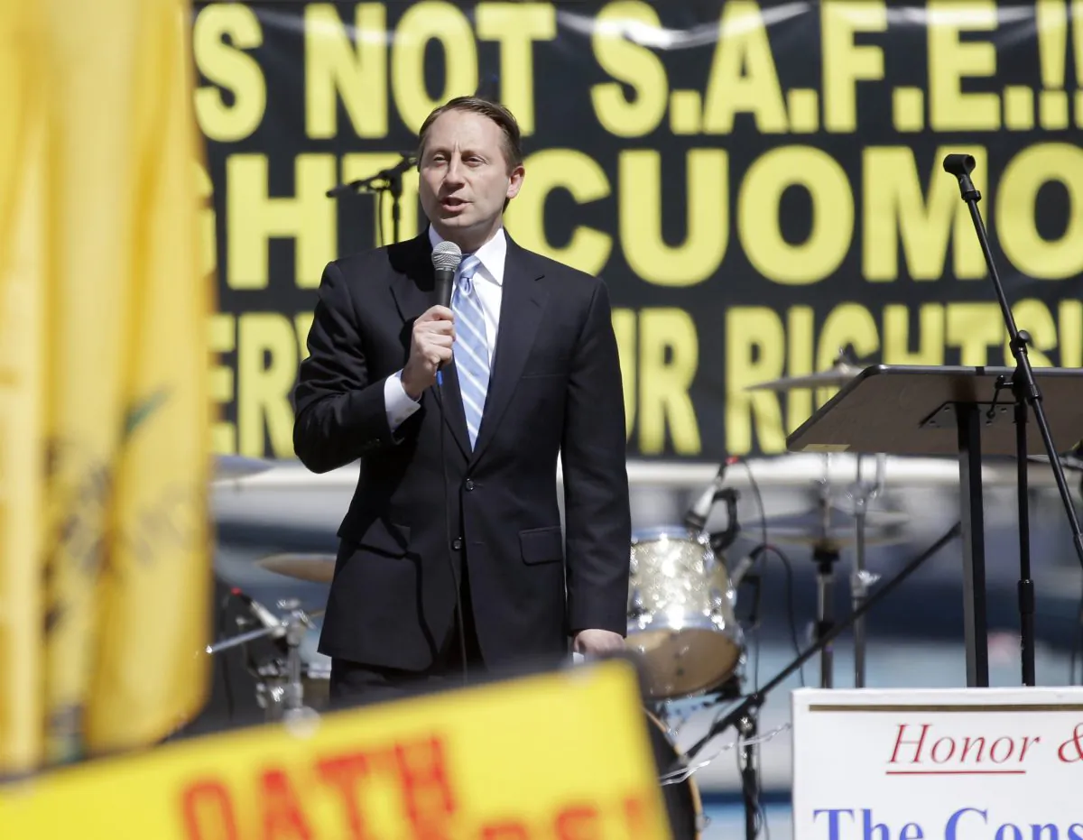 Republican gubernatorial candidate Rob Astorino speaks during a gun rights rally at the Empire State Plaza in Albany, N.Y. on April 1, 2014. Polls have shown majority support for the law spearheaded by Gov. Andrew Cuomo and passed by lawmakers after the 2012 school shooting in Connecticut. (AP Photo/Mike Groll)