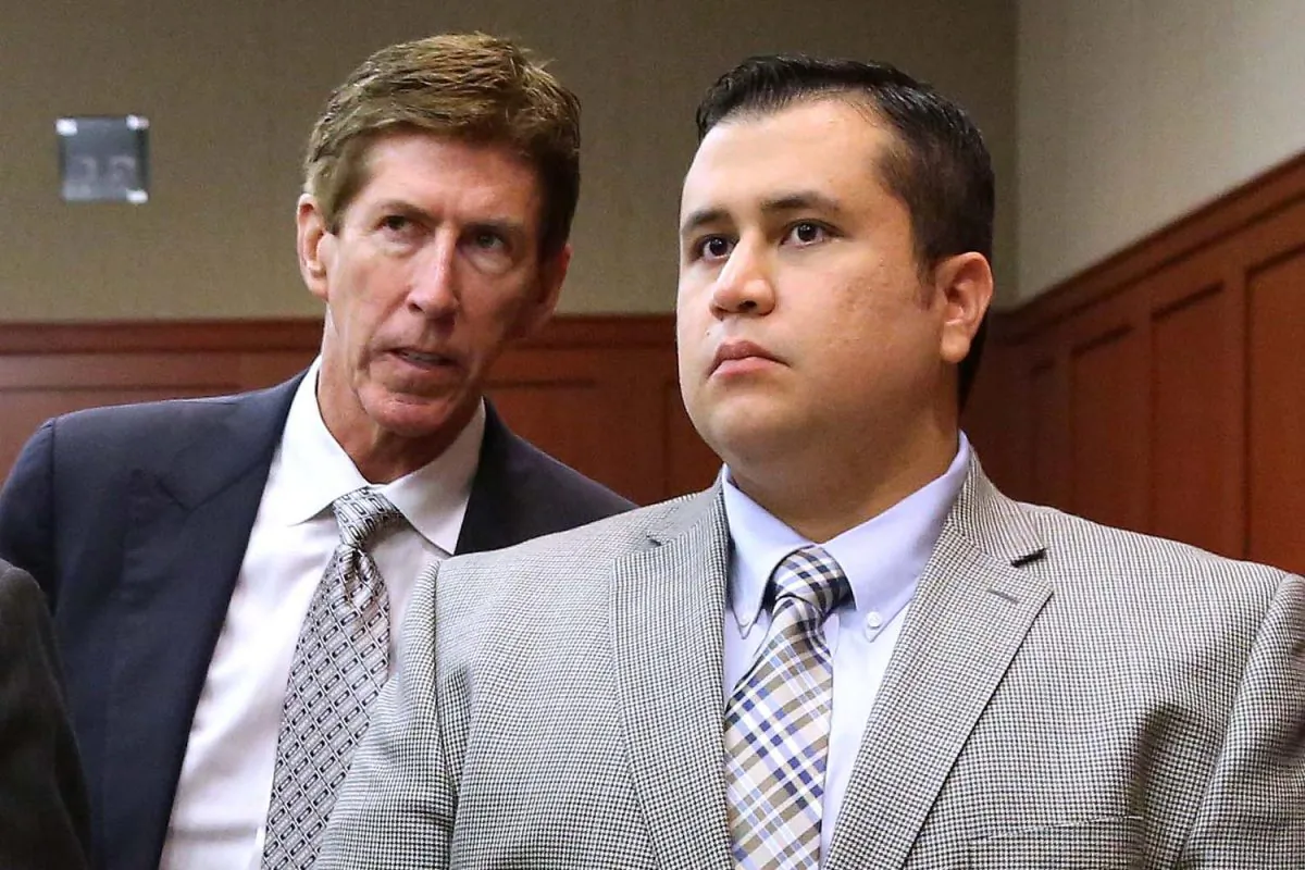 Defense attorney Mark O'Mara, left, talks to defendant George Zimmerman during a recess in Zimmerman's trial in Seminole circuit court in Sanford, Fla. June 17, 2013. (AP Photo/Orlando Sentinel, Joe Burbank, Pool, File)