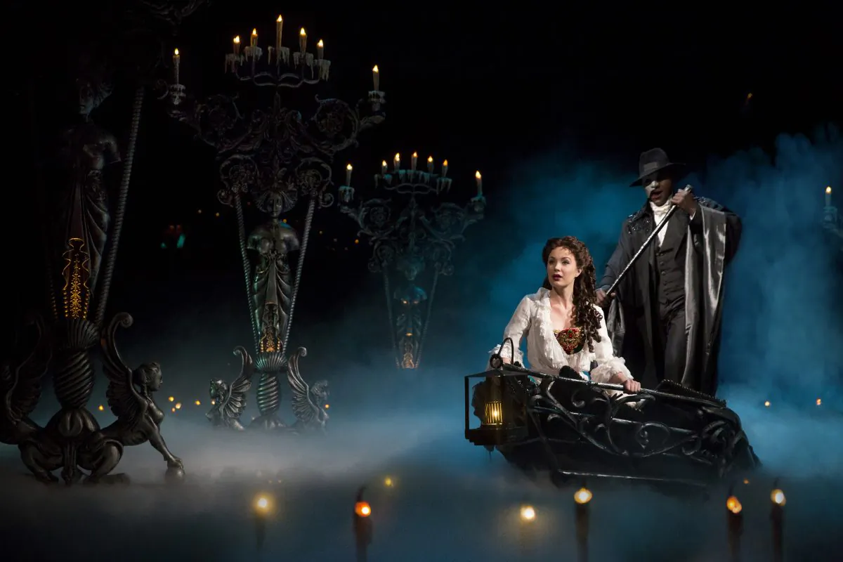 Christine (Sierra Boggess) is spirited away by the Phantom (Norm Lewis) to his underground world. (Matthew Murphy)