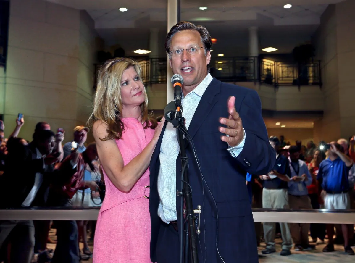 Dave Brat and his wife Laura address supporters after defeating Congressman Eric Cantor in the Republican primary for the 7th Congressional District in Virginia, June 10, 2014 in Henrico, Va. (AP Photo/Richmond Times-Dispatch, P. Kevin Morley)