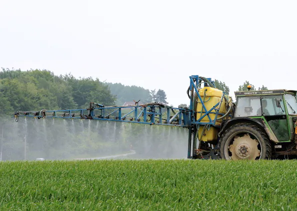 :A farmer drives a tractor to spray pesticides on his field, on June 11, 2013 in Godewaersvelde, northern France. (Philippe Hugen/AFP/Getty Images)