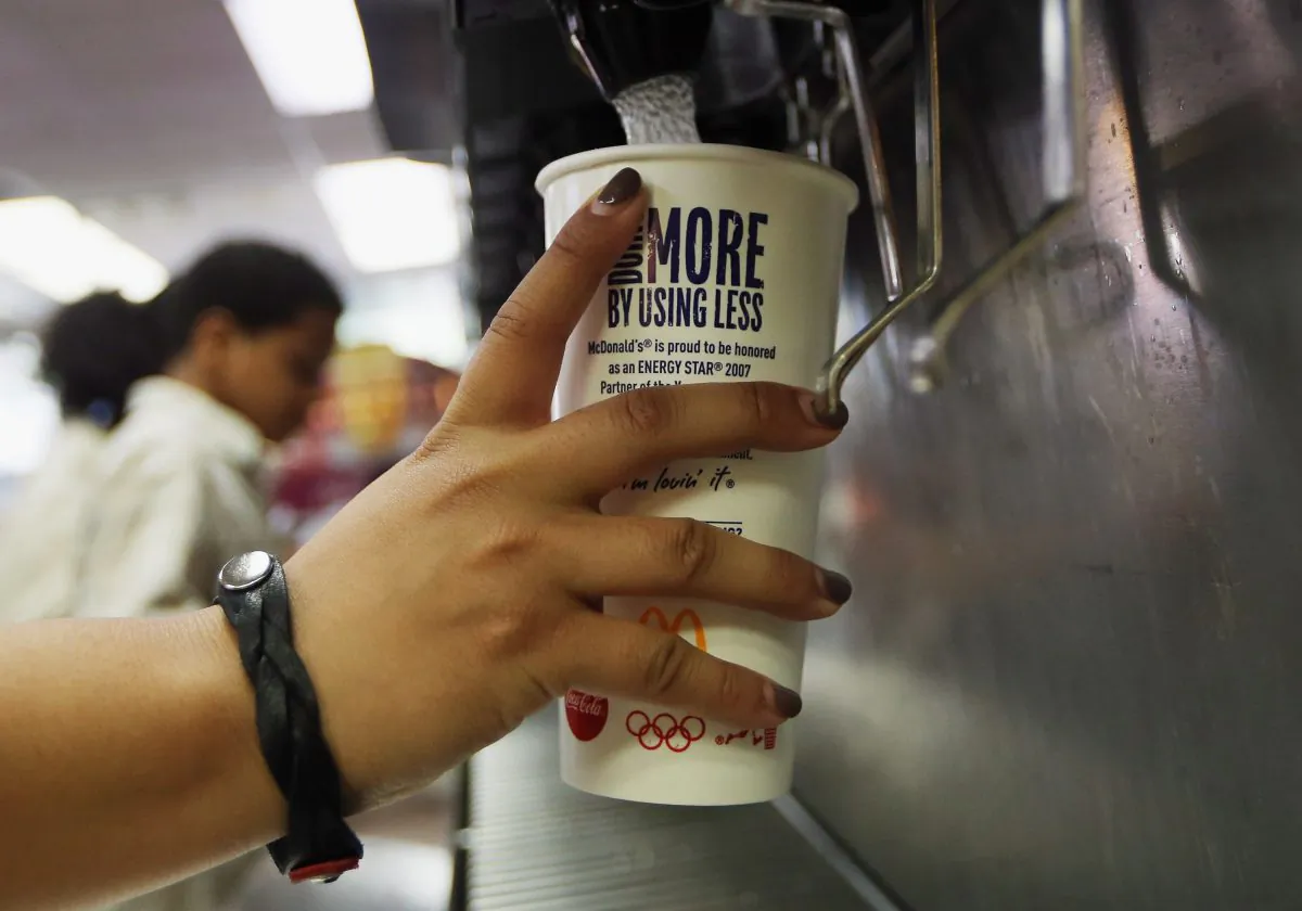 A customer fills a 21-ounce cup with soda at a McDonald's restaurant in Manhattan in 2012. (Mario Tama/Getty Images)