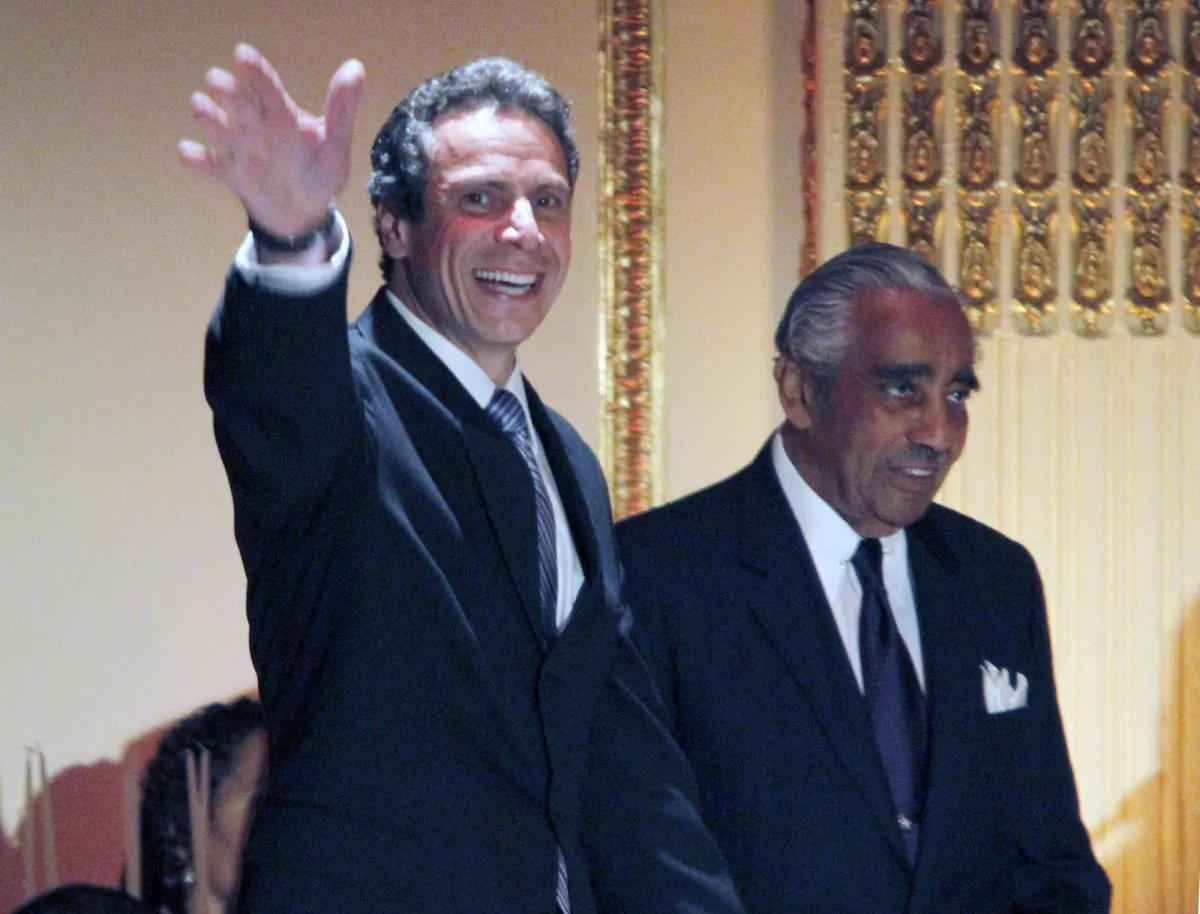 Andrew Cuomo, then New York attorney general, joins Charles Rangel in a birthday fundraiser for the congressman on Aug. 11, 2010. (AP Photo/Mary Altaffer)