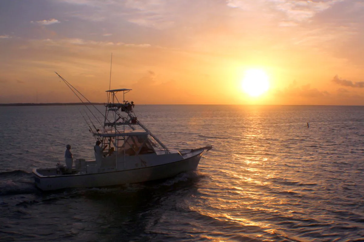 Sunrise over the Atlantic Ocean as sport fishing boats leave Whale Harbor. (Myriam Moran copyright 2014)