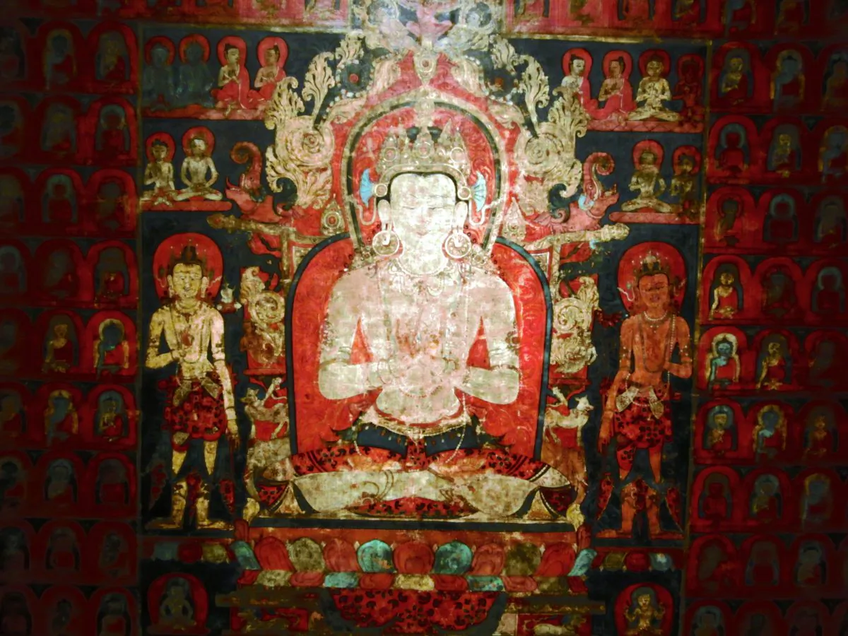 A set of Tibetan paintings show each of the five directional Buddhas, here Vairochana, the “all-seeing,” the “Radiant One,” in a field of all five directional Buddhas, including himself. Vairochana, Buddha of the center, 1300–1400, Tibet, colors on cotton, detail. (Cornelia Ritter/Epoch Times)