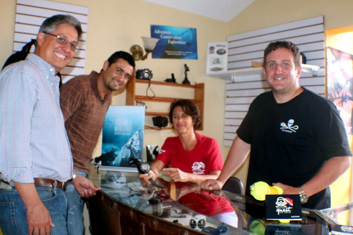 Divers Paul Rodiguez, Amerigo Moran with Sabine Steiner (seated) and Bill Schoening in Water Quest's dive shop in Guatemala City. (Myriam Moran copyright 2014)