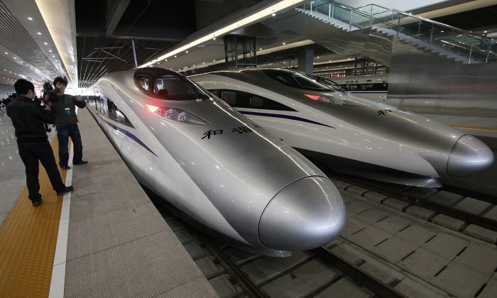 Bullet trains of a new high-speed railway linking Shanghai with Hangzhou Tuesday, Oct. 26, 2010 in Shanghai, China. (AP Photo/Eugene Hoshiko)