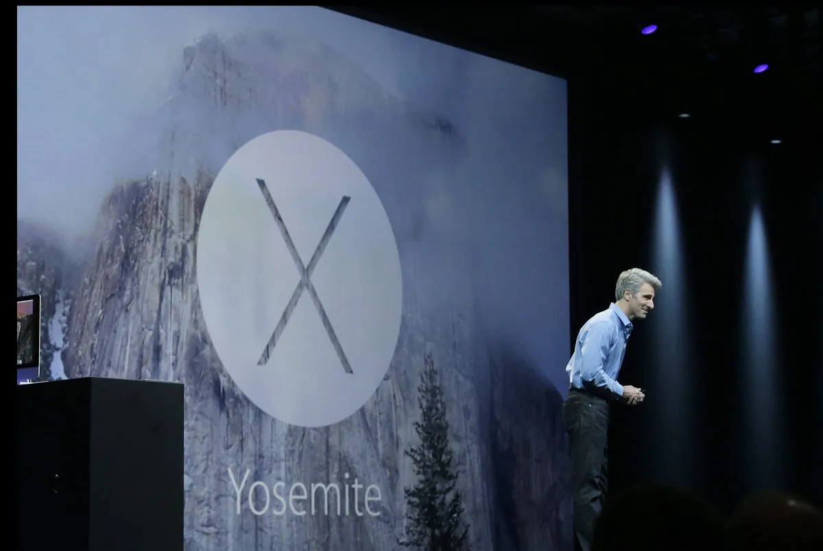 Apple senior vice president of Software Engineering Craig Federighi introduces the Yosemite operating system during the Apple Worldwide Developers Conference in San Francisco, Monday, June 2, 2014. (AP Photo/Jeff Chiu)