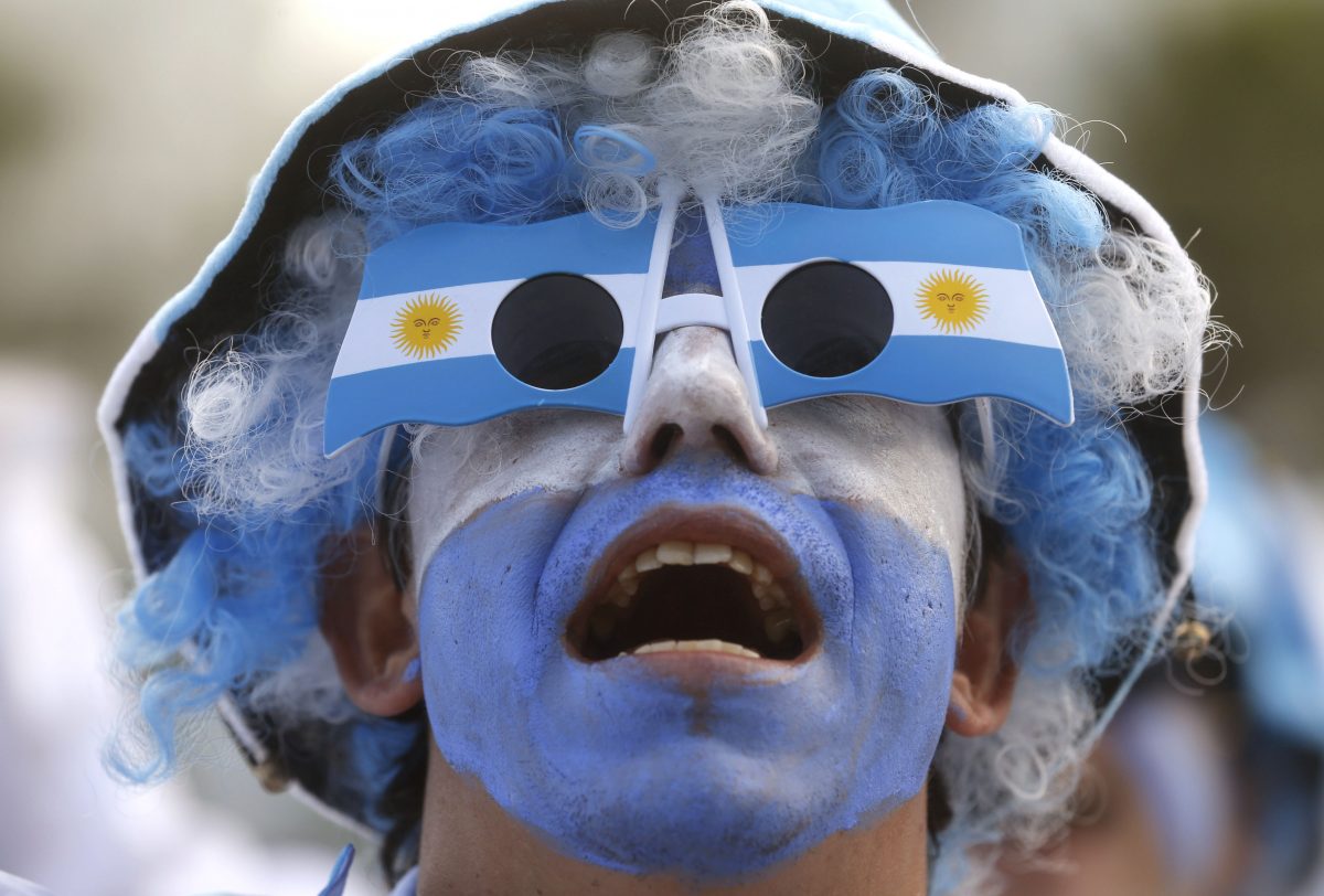 An Argentina soccer fan watches his team's World Cup match with Iran at a live telecast inside the FIFA Fan Fest area on Copacabana beach, in Rio de Janeiro, Brazil, Saturday, June 21, 2014. Argentina won 1-0. (AP Photo/Silvia Izquierdo)