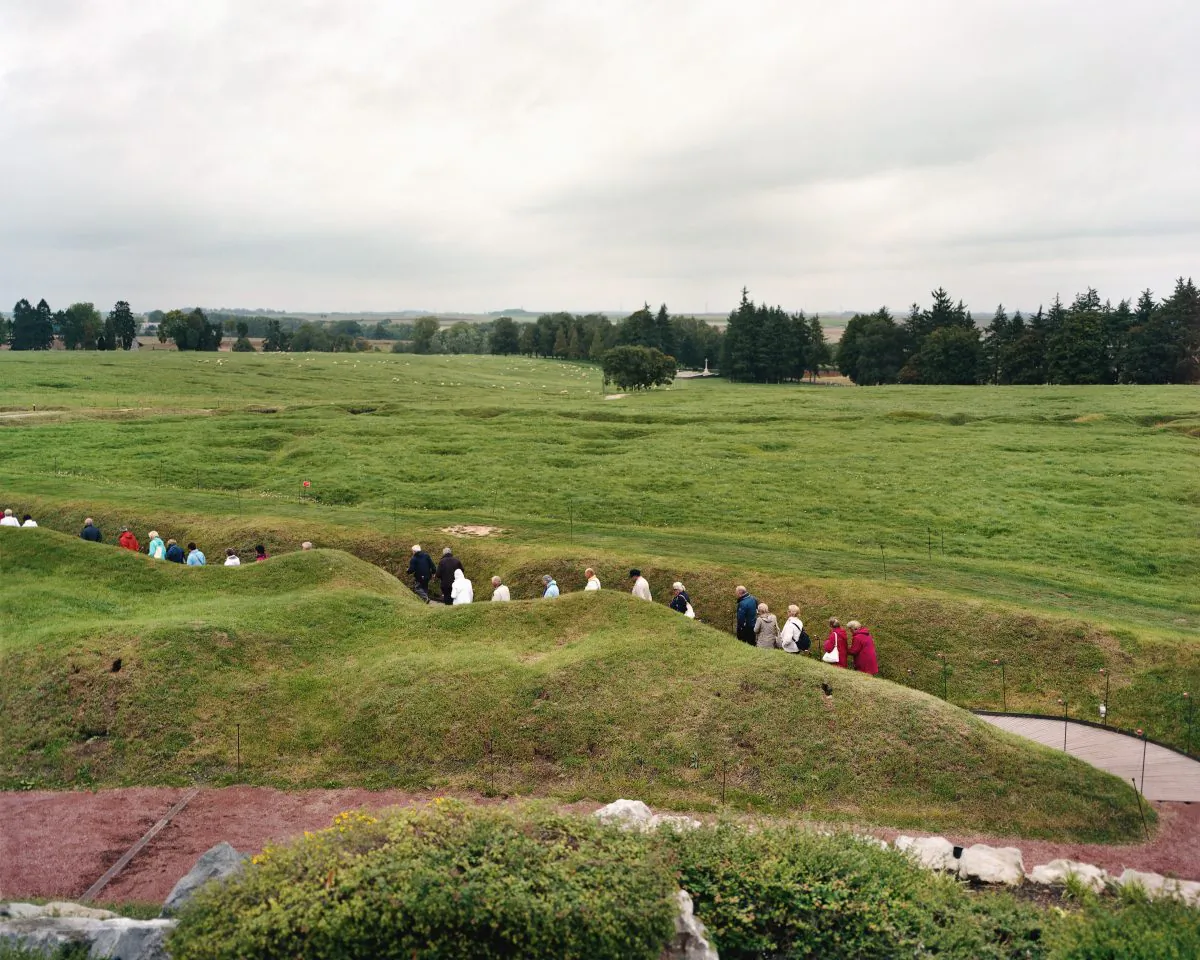 “Beaumont-Hamel 1” shows a line of tourists walking through rebuilt trenches. Beaumont-Hamel was very close to the front lines during World War I and saw heavy combat, especially during the Battle of the Somme. By 1918 the village was almost totally destroyed. (Courtesy of Ottawa Art Gallery)