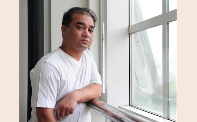 Ilham Tohti, economics professor and webmaster of a popular Uyghur website, was arrested in late 2013 for advocating "splittism". Draconian restrictions on internet usage restrain Uyghur users in Xinjiang Province to a virtual cage, says a human rights group. (Frederic J.Brown/AFP/Getty Images)