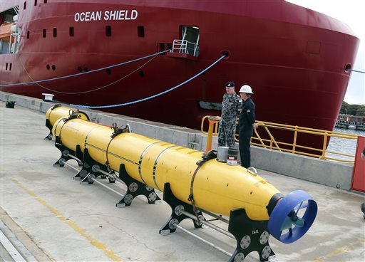 In this March 30, 2014 file photo, an autonomous underwater vehicle (AUV) sits on the wharf at naval base HMAS Stirling in Perth, Australia, ready to be fitted to the Australian warship Ocean Shield to aid in the search for the missing Malaysia Airlines Flight 370. In an interview with The Associated Press, Martin Dolan, chief commissioner of the Australian Transport Safety Bureau, said that he was cautiously optimistic that the lost jet would be found. Dolan said he was confident the airliner was close to a 700-kilometer by 80-kilometer arc of ocean identified from satellite data that investigators would be scouring in the next phase of the search. (AP Photo/Rob Griffith, File)