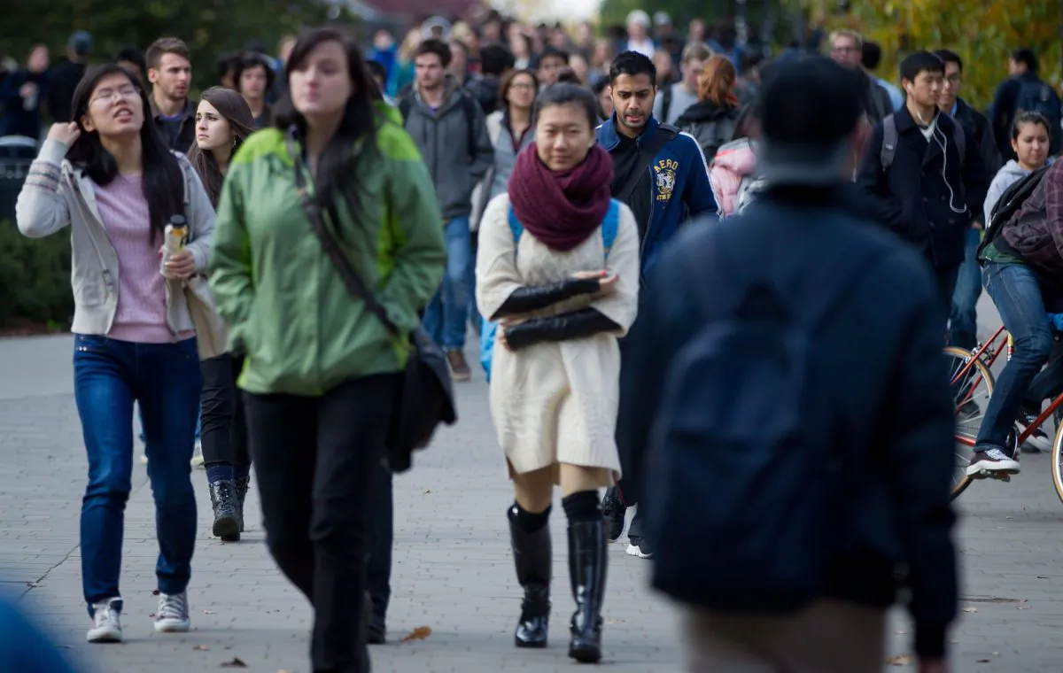 Students walk on the campus at the University of British Columbia in Vancouver. A new online survey shows that parents are increasing their expenses and debt to help pay for their children’s education. (The Canadian Press/Darryl Dyck)
