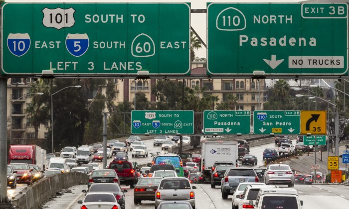 Traffic on the eastbound Hollywood Freeway, U.S. Highway 101, approaches the four-level interchange in downtown Los Angeles, Calif. on Feb. 6, 2014. (AP Photo/Damian Dovarganes)