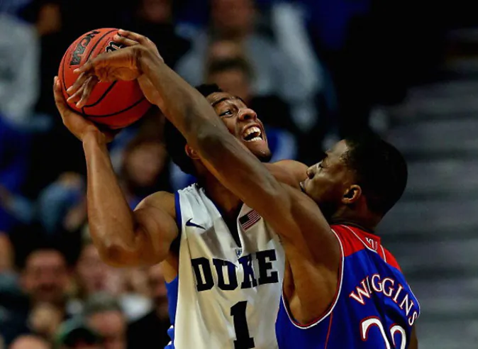Jabari Parker #1 of the Duke Blue Devils tries to shoot against Andrew Wiggins #22 of the Kansas Jayhawks during the State Farm Champions Classic at the United Center on November 12, 2013 in Chicago, Illinois. Kansas defeated Duke 94-83. (Jonathan Daniel/Getty Images)