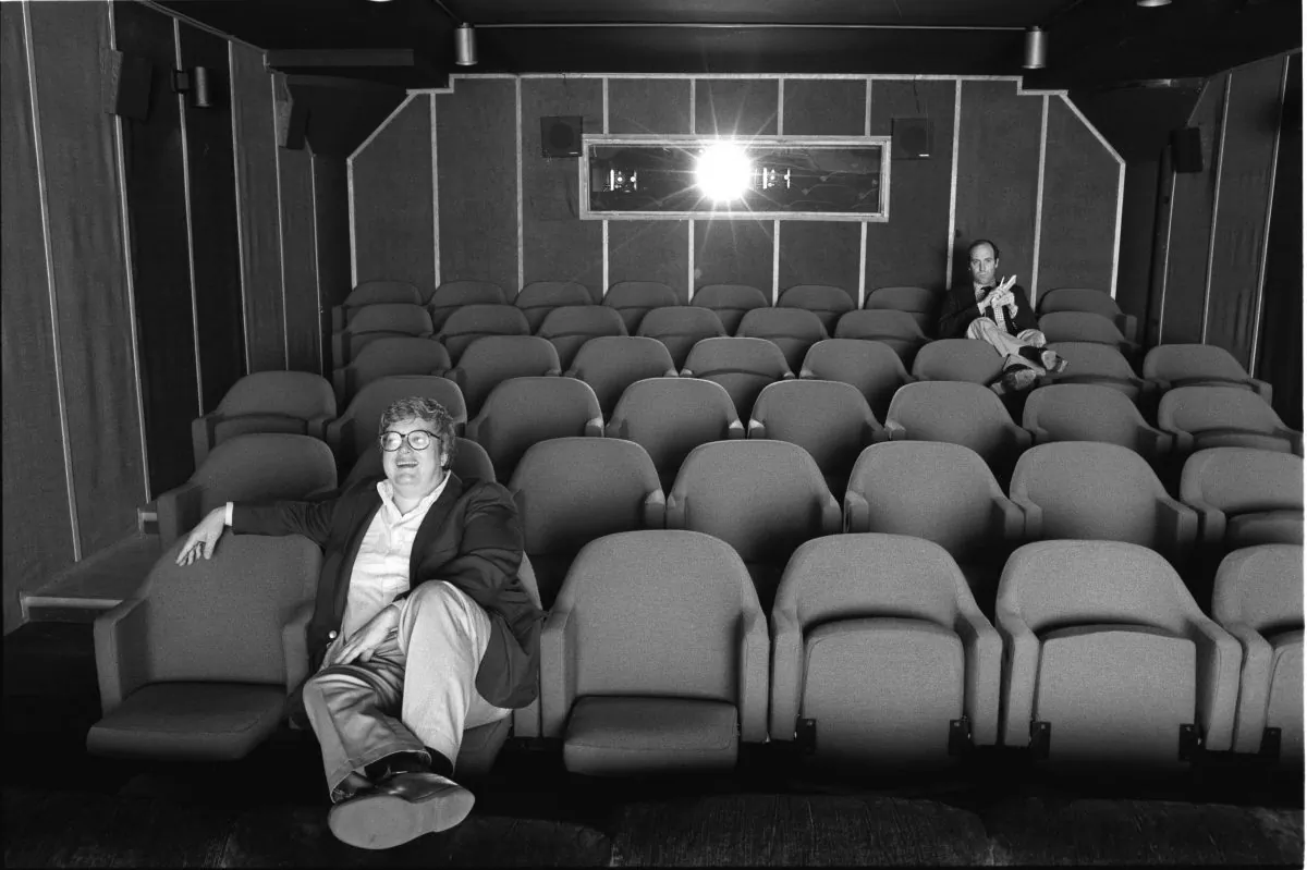 Gene Siskel and Roger Ebert in screening room for photo shoot for People Weekly, June 13, 1984; Chicago. (Kevin Horan/Magnolia Pictures)