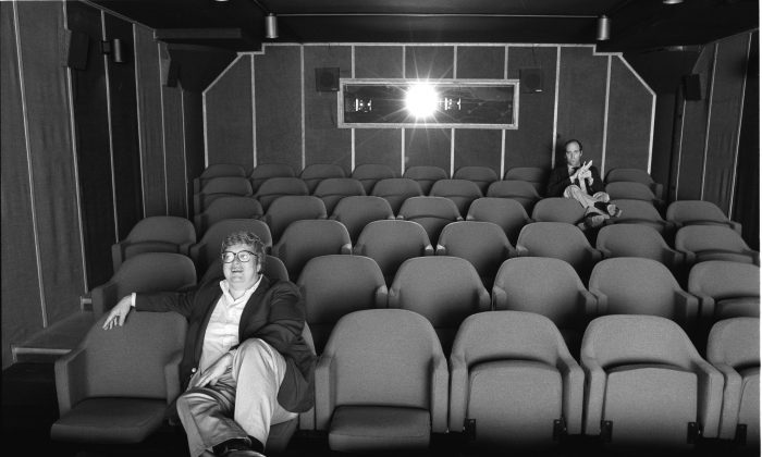 Gene Siskel and Roger Ebert in screening room for photo shoot for People Weekly, June 13, 1984; Chicago. (Kevin Horan/Magnolia Pictures)
