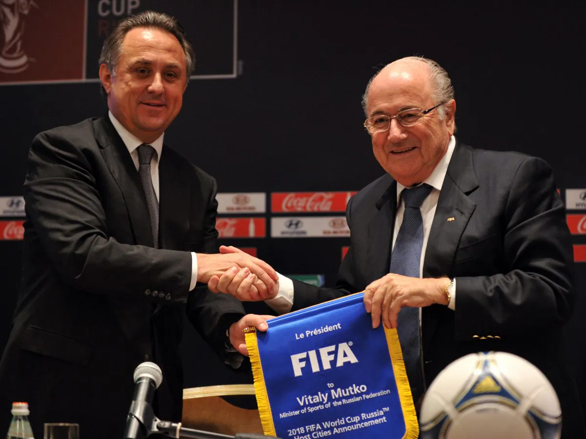 FIFA president Sepp Blatter (R) shakes hands with Russian Sports Minister Vitaly Mutko (L) after their news conference in Moscow on September 30, 2012. Russia and FIFA on Saturday unveiled the 11 cities from the Baltic to the Urals that will host the 2018 World Cup in the most ambitious project the country has organised since the fall of the USSR. (YURI KADOBNOV/AFP/GettyImages)