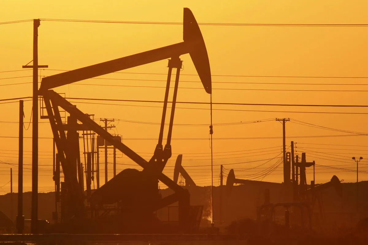 Pump jacks are seen at dawn in an oil field over the Monterey Shale formation where gas and oil extraction using hydraulic fracturing, or fracking, is on the verge of a boom, near Lost Hills, Calif., on March 24, 2014. The cheap energy provided by fracking has helped drive a resurgence in U.S. manufacturing. (David McNew/Getty Images)