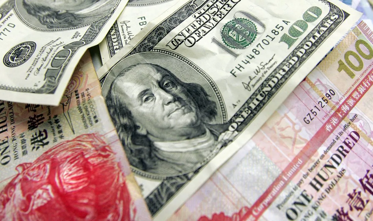 Hong Kong and US dollars in Hong Kong on Jan. 12, 2008. The Hong Kong dollar is a currency pegged to the U.S. dollar. Under the LERS, HK$1,000 is worth USD$ 127 as of Jul. 22, 2022. (Laurent Fievet/AFP/Getty Images)