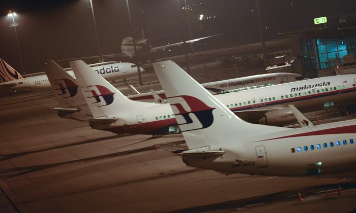 Malaysia Airlines planes are parked at Kuala Lumpur International Airport in Sepang, Malaysia, Thursday, July 18, 2013.  A Malaysia Airlines flight with nearly 300 people aboard crashed over eastern Ukraine near the Russian border on Thursday, the Ukraine government and a regional European aviation official reported, Thursday, and the Interfax news agency said it had been shot down. (AP Photo/Joshua Paul)