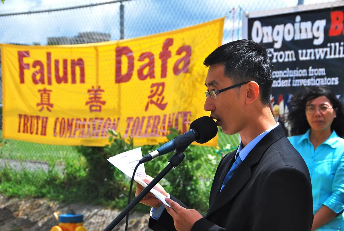 Falun Gong practitioner Paul Li speaks about his father, Li Xiaobo, who was imprisoned for eight years in China for practicing Falun Gong and was recently rearrested. Paul Li called on the Canadian government to help free his father in his speech at an event in front of the Chinese embassy in Ottawa on July 17, 2014, to mark 15 years since the persecution of Falun Gong began in China on July 20, 1999. (Courtesy of NTD Television)