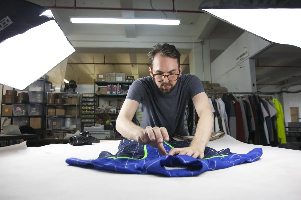 David Krause setting up a photo shoot for Alder New York at Pratt Institute's Brooklyn Fashion+Design Accelerator's temporary space at the Brooklyn Navy Yard, July 14, 2014. (Samira Bouaou/Epoch Times)