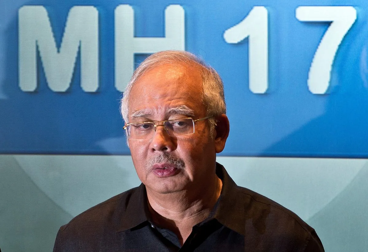 Malaysia's Prime Minister Najib Razak addresses a press conference at a hotel in Sepang, ouside Kuala Lumpur, on July 18, 2014, after Malaysia Airlines flight MH17 carrying 298 people from Amsterdam to Kuala Lumpur crashed in eastern Ukraine. A Malaysian airliner carrying 298 people from Amsterdam to Kuala Lumpur crashed on July 17 in rebel-held east Ukraine, as Kiev said the jet was shot down in a 'terrorist' attack. Ukraine's government and pro-Russian insurgents traded blame for the disaster, with comments attributed to a rebel commander suggesting his men may have downed Malaysia Airlines flight MH17 by mistake, believing it was a Ukrainian army transport plane. (MANAN VATSYAYANA/AFP/Getty Images)