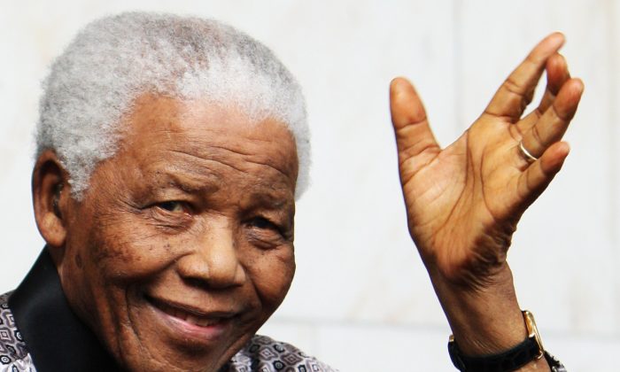 Nelson Mandela leaves the InterContinental Hotel after a photoshoot with celebrity photographer Terry O'Neil on June 26, 2008 in London, England. Mandela is in London in advance of the 46664 concert being held at Hyde Park on Friday the 27th June to celebrate Nelson Mandela's 90th Birthday. (Chris Jackson/Getty Images)