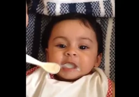 Cute Baby Gargles Her Food (Video)