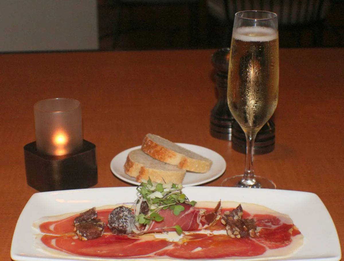 Serrano ham with almond crusted dates. It tastes as delicious as it looks. A specialty on One Lincoln Restaurant's charcuterie plate. (Myriam Moran copyright 2014)