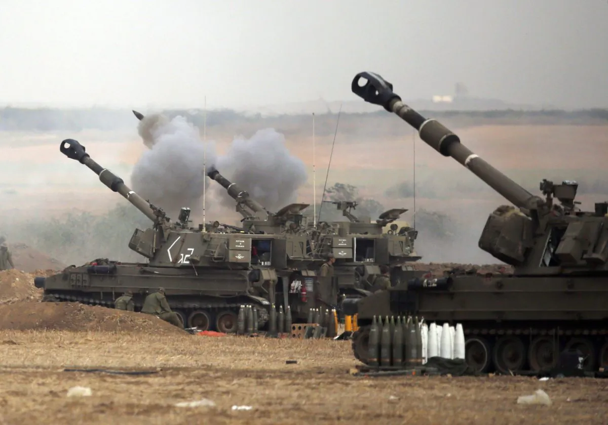 An Israeli artillery fires a 155mm shell towards targets in the Gaza Strip from their position near Israel's border with the Strip on July 20, 2014.  (Jack Guez/AFP/Getty Images)