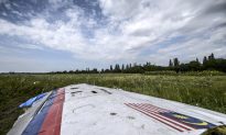 Malaysia Flight MH17 Crash Site Photos: See Pictures of Bodies, Rescue, Wreckage (Some Graphic)