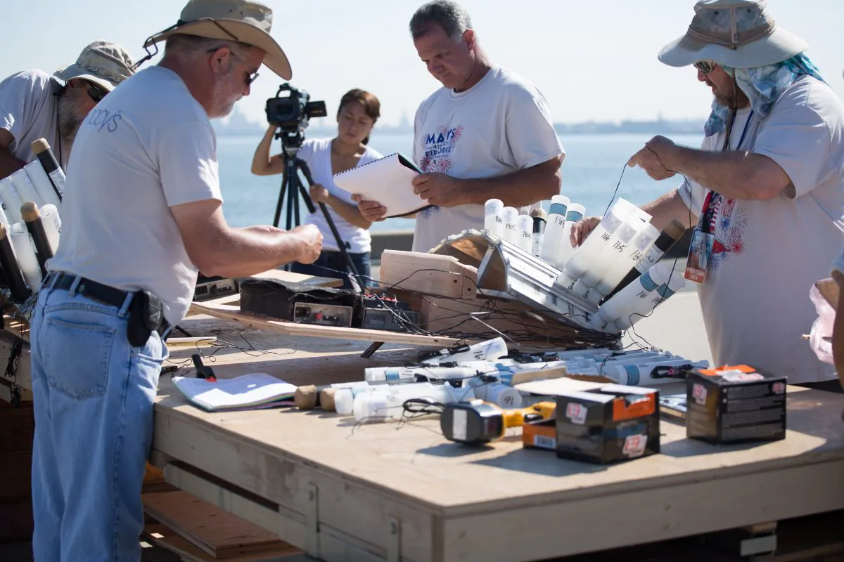 Pyrotechnicians prepare the wiring for the fireworks that will be used in Macy’s 4th of July fireworks on a barge in Staten Island, in New York City, on June 28, 2014. (Laura Cooksey/Epoch TImes)